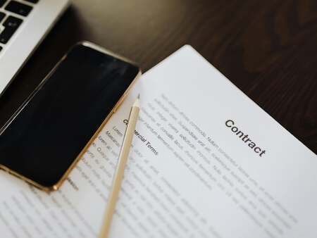 Commercial Lease Review - Photo of a contract and pencil on top of a table