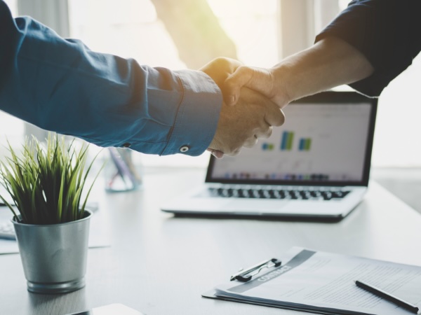 Industry Relationships - two people shaking hands